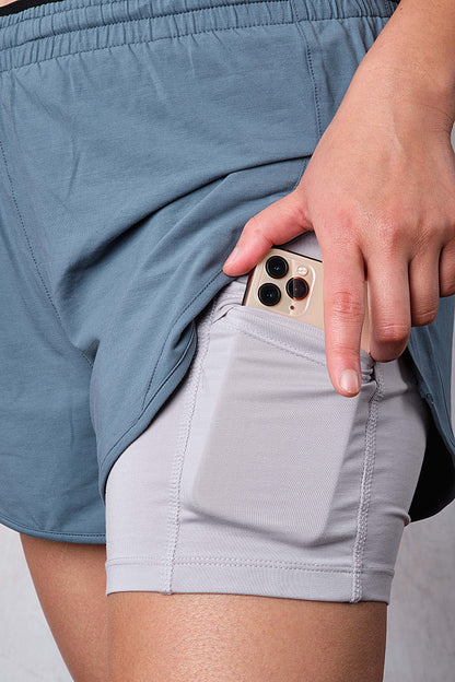 Biodegradable 2 in 1 Natural  Modal Performance Shorts in blue - side pocket - iPhone size 